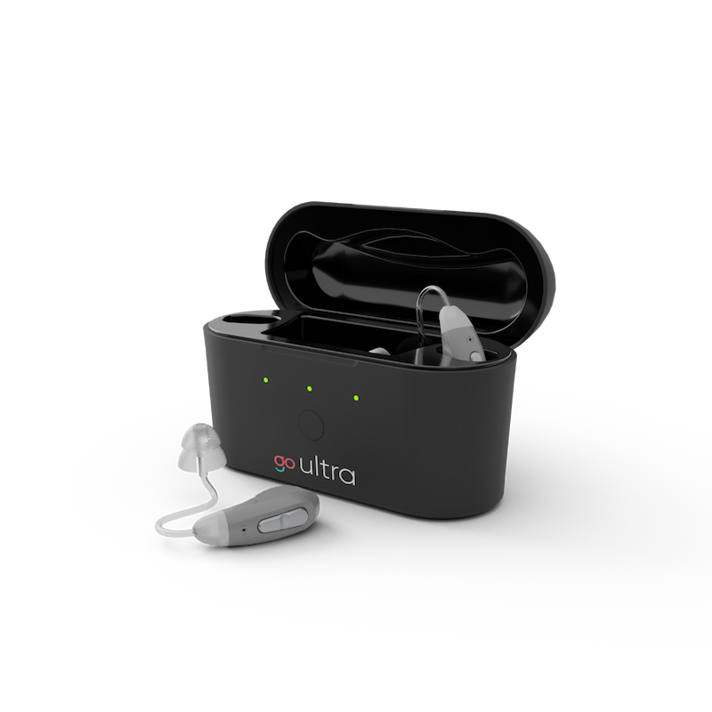 Go Ultra otc hearing aids and charging case. One hearing aid in the case and one outside.